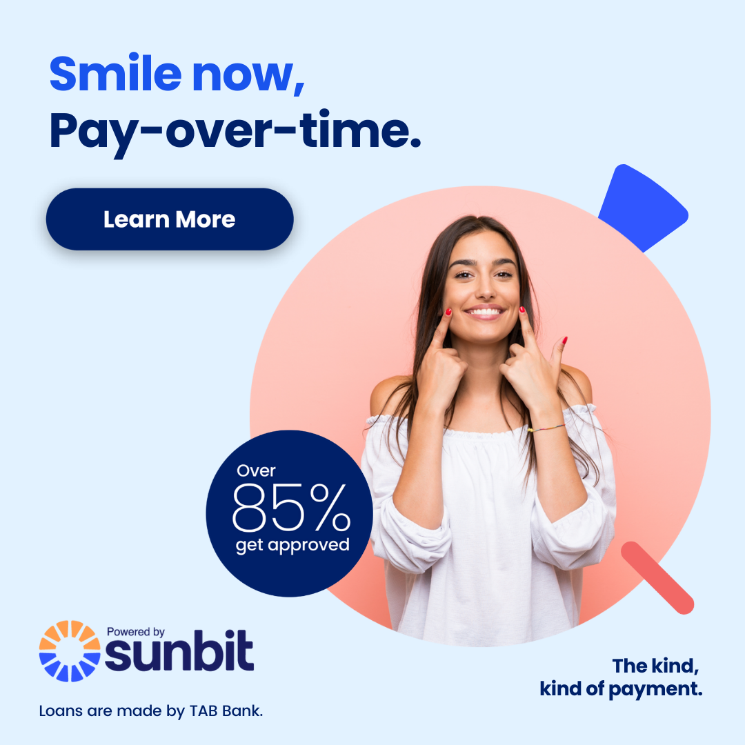 Woman smiling while touching face, promoting dental payment plan with 85% approval rate offer.